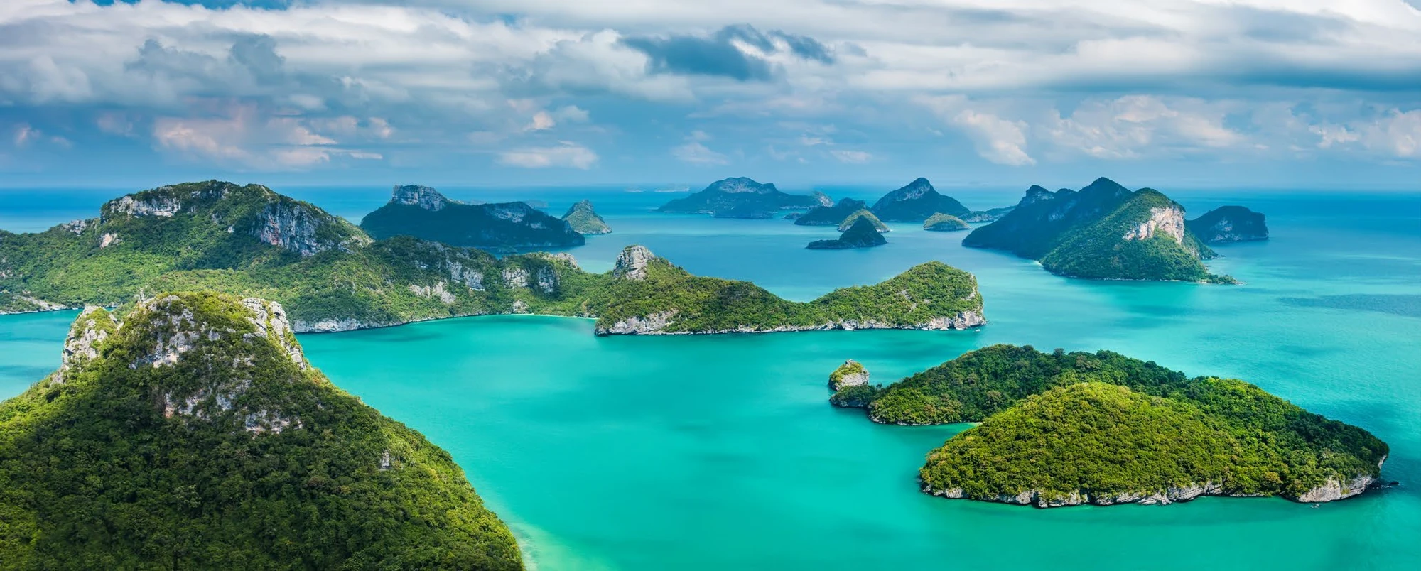 Turquoise water and lush island formations from the supplied brochure
